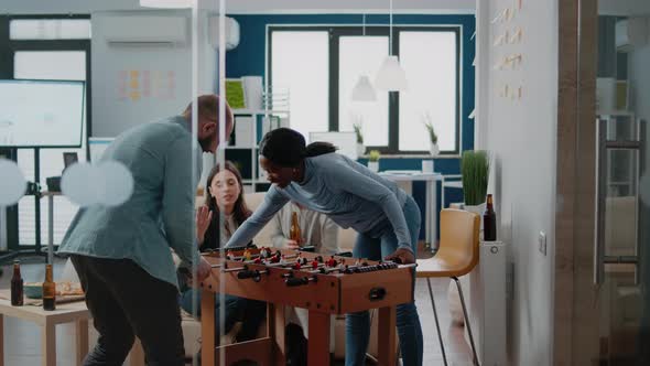 Frustrated Man Losing Foosball Game Having Fun After Work