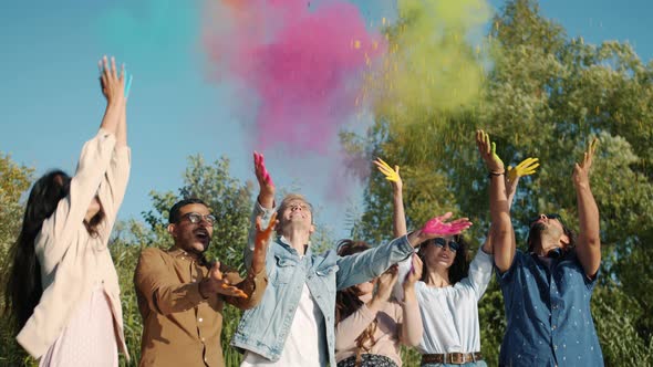 Slow Motion of Happy Young People Throwing Colorful Powder Paint During Indian Holi Festival