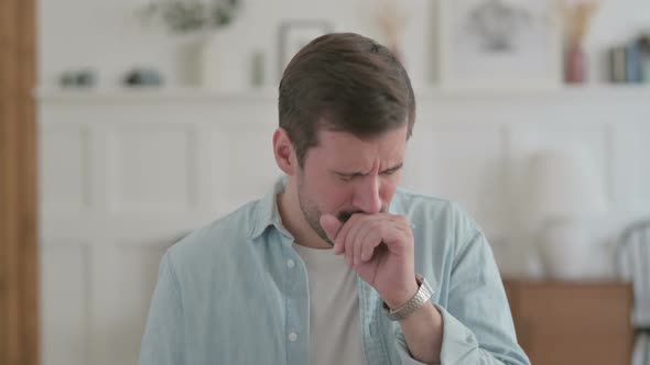 Portrait of Sick Young Man Coughing and Feeling Unwell