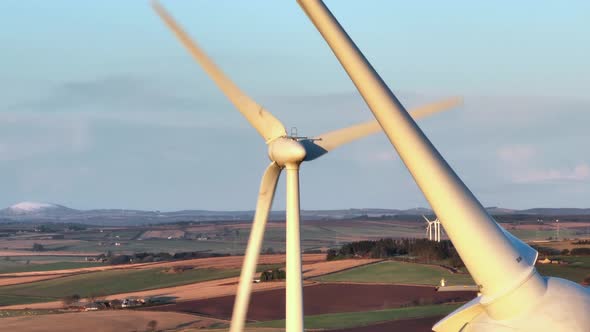 Wind Farm Turbines at Sunset Generating Renewable Power