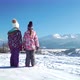 Back View of Children Standing on Rural Roadway in Snow Looking at Mountain Range in Sunshine - VideoHive Item for Sale