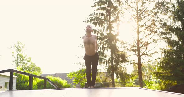 Yogi Stretching on Wooden Platform in Morning