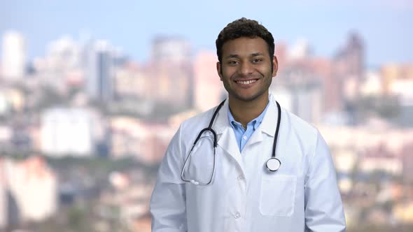 Portrait of Young Smiling Doctor Looking at Camera