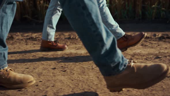 Agronomists Boots Walking Dry Ground Soil Together at Autumn Countryside Closeup