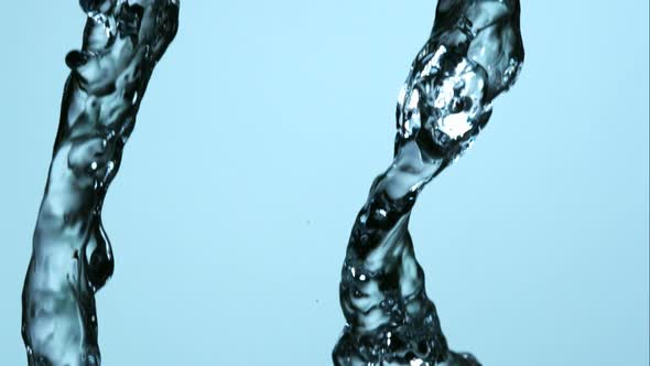 Water pouring and splashing in ultra slow motion 1500fps on a reflective surface - WATER POURS