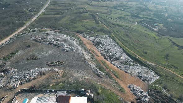 Aerial View of the Garbage Truck Near the Agricultural Lands