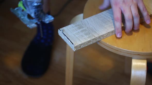 The Man Marks The Extra Part Of The Board With The Marker