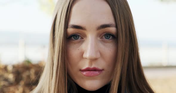 Portrait of Young Attractive Female Looking at the Camera on Autumn Park, Cheerfully Pretty Woman at