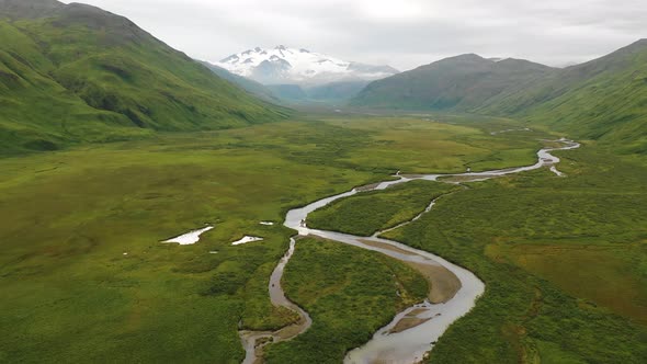 Aerial view of a river streaming from the glacier, Alaska, United States.