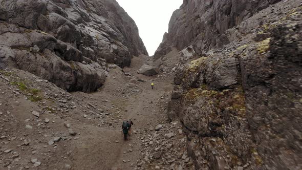 An Aerial View of a Group of Tourists Hiking Between the Khibiny Mountains