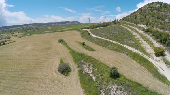 Countryside Agricultural Fields With Wind Turbines, Alternative Energy, Aerial