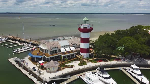 A wide orbiting shot of the lighthouse at Harbor Town on Hilton Head Island, SC