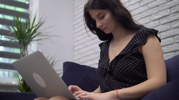 Attractive Woman Typing on Laptop Distance Working at Home Female Freelance