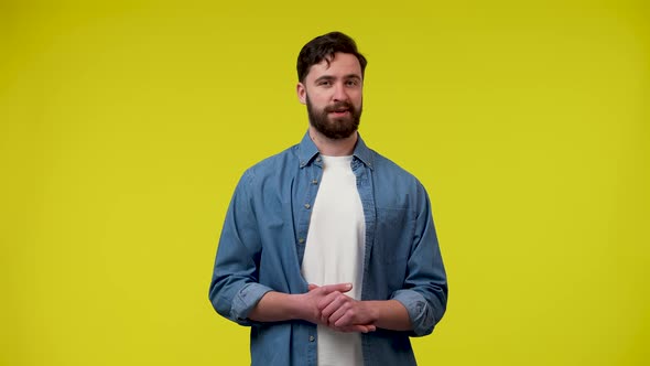 A Portrait of a Bearded Man Flirting Making Eyes Wiggling His Eyebrows and Pointing with His Index