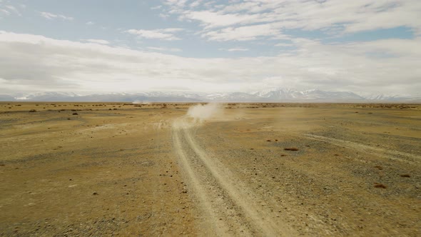 Dust From the Movement of a Car in the Mountain Steppe