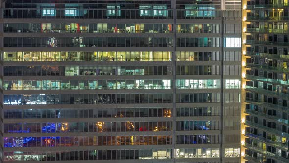 Windows of Office Buildings at Night Timelapse the Light From the Windows of Houses