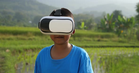 Rural Boy Wears A VR Headset And Dancing alt