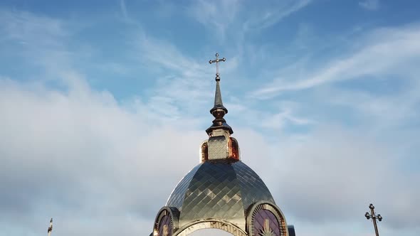 Aerial View of Cathedral Blue Dome with Golden Stars Cross. Sunny Day.