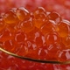 Caviar. Red caviar in golden spoon close up - VideoHive Item for Sale