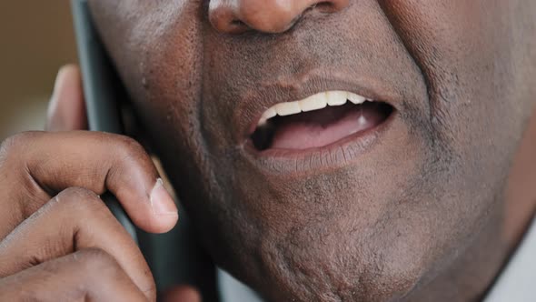 Unknown Half Face Part Old Wrinkled Emotional Businessman African Mature Man Talking on Mobile Phone