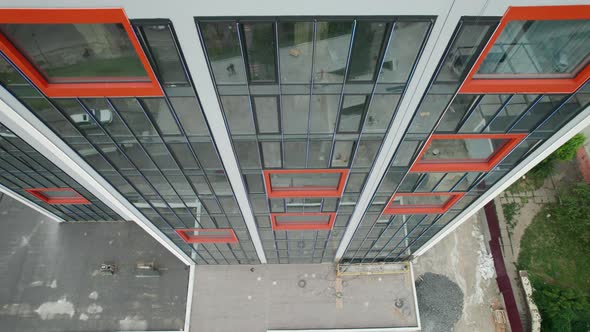 Aerial View of the Exterior of a Modern Hotel Building with Large Windows