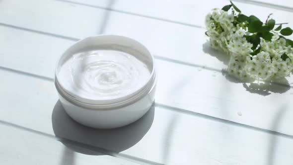 White cosmetic cream in a skin care jar.