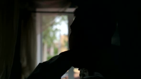 Closeup of a Man Tying Bow Tie