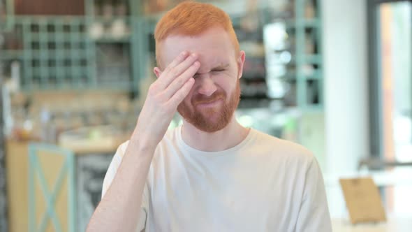 Portrait of Stressful Redhead Man Having Headache