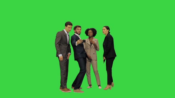 Young Business People in Suits Taking a Selfie on a Green Screen Chroma Key