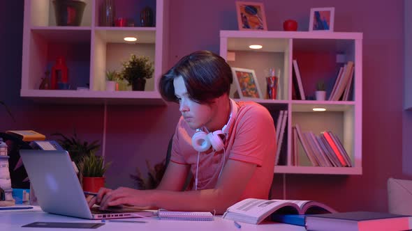 Male student doing research.