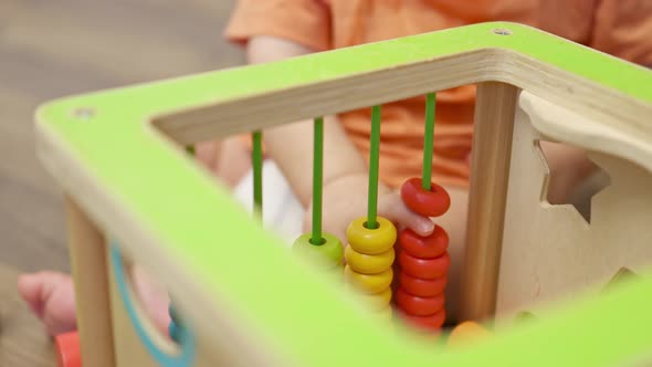 Tiny Baby Kid Toddler Hands Playing Colorful Wooden Abacus Toy