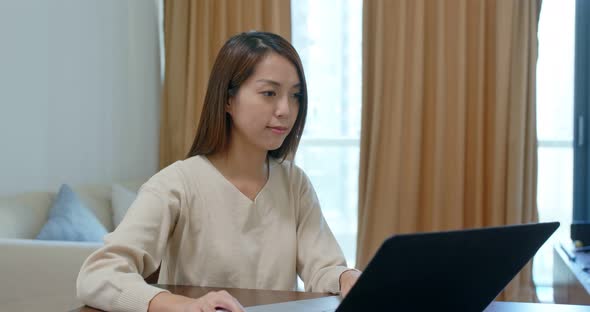 Woman work on laptop computer at home