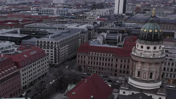 AERIAL: Slowly Passing Beautiful Old Church Over Plaza in the Center of Berlin Germany at Sunset 