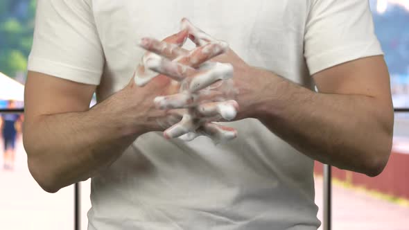 Man Thoroughly Washing His Hands with Soap Foam