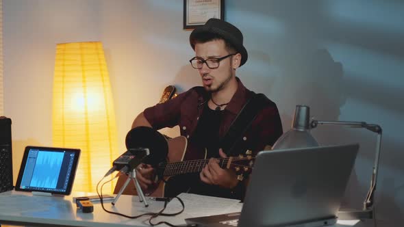 Guitarist is Dissatisfied with His Friend Playing the Instrument and Showing His Mistake in Musical