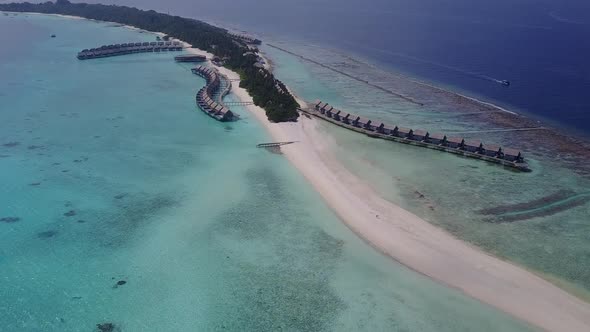 Aerial drone travel of seashore beach voyage by blue ocean with sand background