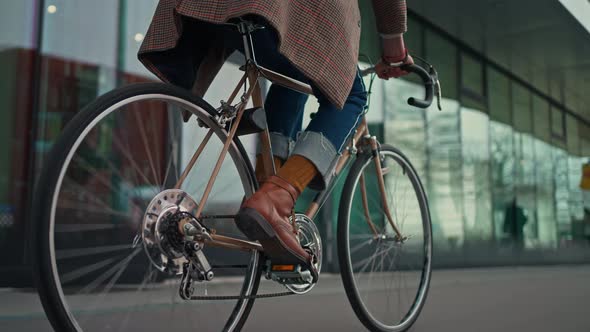 Midsection Close Up Leg Shot of a Businessman with Bicycle Commuting to the Office