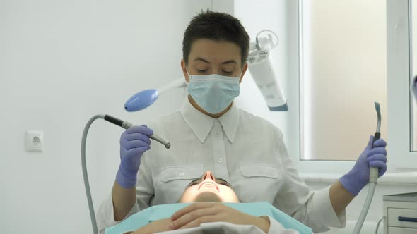 Dentist treating his patient