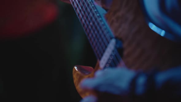 Closeup on Guitarist Hands Playing Solo During Concert
