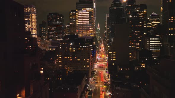 Downtown Manhattan with Busy Car Traffic and City Lights