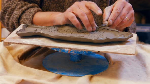 Potter working on clay sculpture