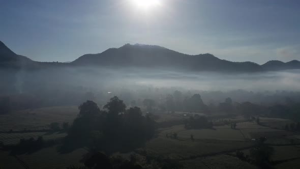 Aerial View of Pai Rice Fields During Sunrise with Fog in Mae Hong Son Thailand