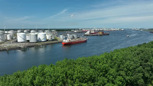 Crude Oil Tanker Vessel Unloading Petrochemicals to a Shore Fuel Depot