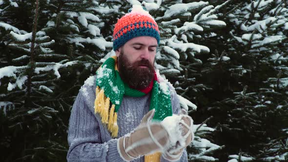 Man Playing Snowballs. People, Winter Season and Leisure Concept. Christmas Time and Snow Outside