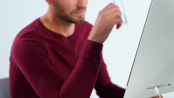 Thoughtful male executive working on personal computer 4k