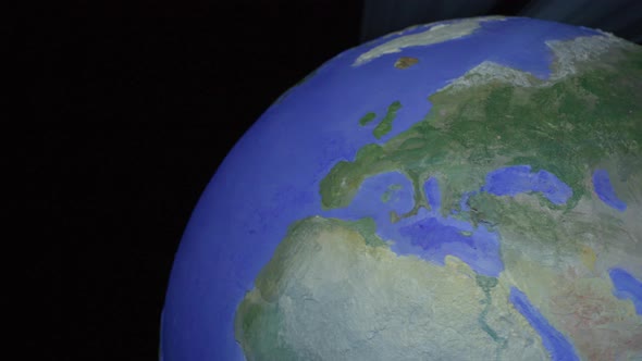 Seamless Loop of Blue Light Ray Style Globe