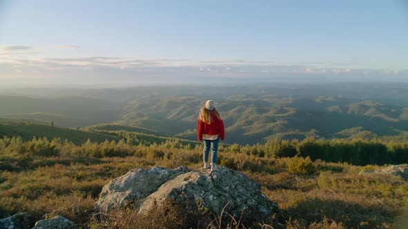 Woman in Red Sweater Rise Hands on Mountain Top