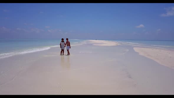 Man and lady tan on relaxing shore beach journey by turquoise sea with white sandy background of the