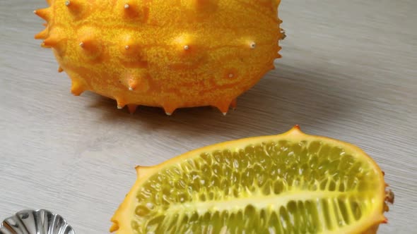  Whole and halved horned melon fruit close up 