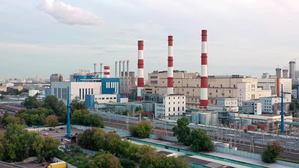 Aerial Drone Zoom in Shoot of White Red Tubes of Manufacturing Industrial Plant